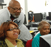 2 women at Occur learning to use a computer