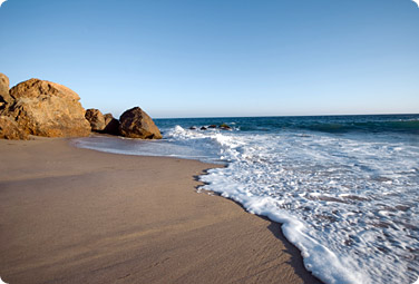 Tide rolling on a sandy beach