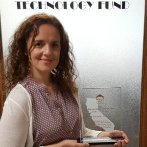 Photo: Raquel Cinat holds the 2016 California Housing Hall of Fame – Public Sector