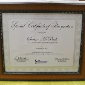 Photo of framed award: Special Certificate of Recognition and Appreciation of supporting San Bernardino County Unified School District’s efforts to bridge the Digital Divide for its students.